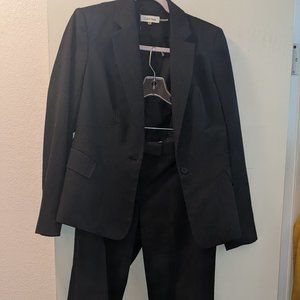 Calvin Klein Womans suit charcoal gray. Jacket size 6, slacks size 4.